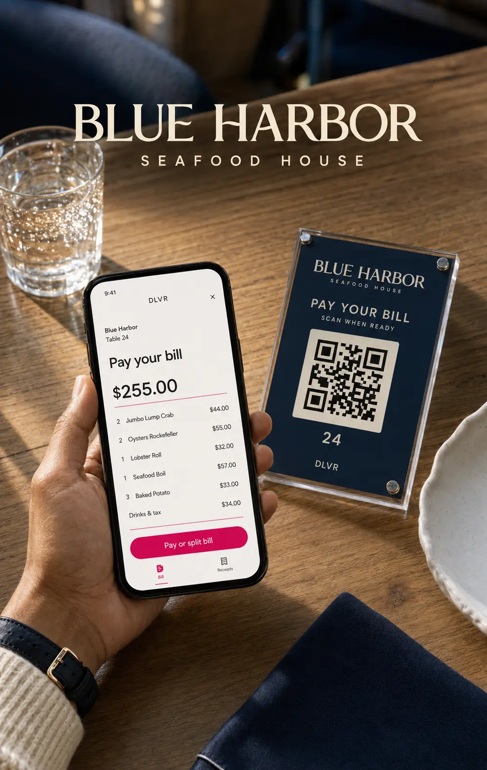 Seafood restaurant bill open on a phone next to a QR table card